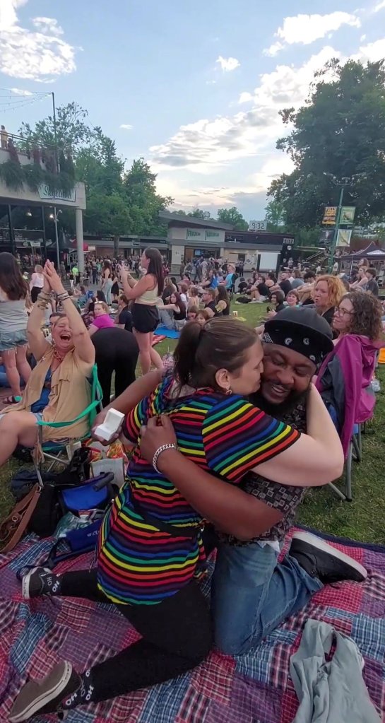 Video capture of Rachel Hundertmark and Rashad Polk's double proposal at the Modest Mouse concert